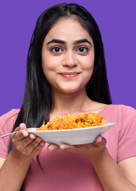 foodie-girl-feeling-happy-holding-biryani-indian-pakistani-model 1