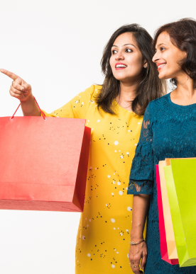 indian-mother-daughter-sisters-shopping-with-colourful-bags-standing-isolated-white-background 1